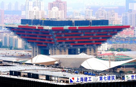Photo taken on July 4, 2009 shows the China Pavilion under construction for the Shanghai 2010 World Expo in Shanghai, east China. The Shanghai 2010 World Expo is to open on May 1, 2010. (Xinhua/Guo Changyao)