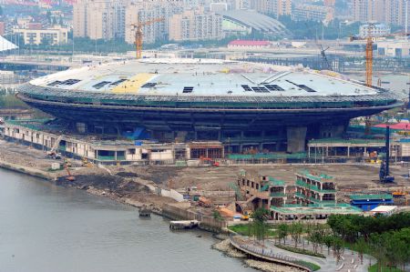 Photo taken on July 4, 2009 shows the Performing Arts Center under construction for the Shanghai 2010 World Expo in Shanghai, east China. The Shanghai 2010 World Expo is to open on May 1, 2010. (Xinhua/Guo Changyao)
