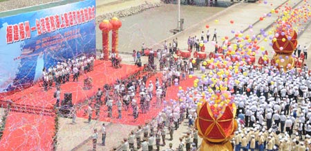 The launching ceremony of combined passenger-cargo vessel "New Golden Bridge II" is held in Fuzhou, capital of southeast China's Fujian Province, July 13, 2009. The first combined passenger-cargo vessel left the Chinese mainland bound directly for Taiwan Monday morning. It is the maiden voyage after the mainland and Taiwan started direct air and sea transport and postal services last December.